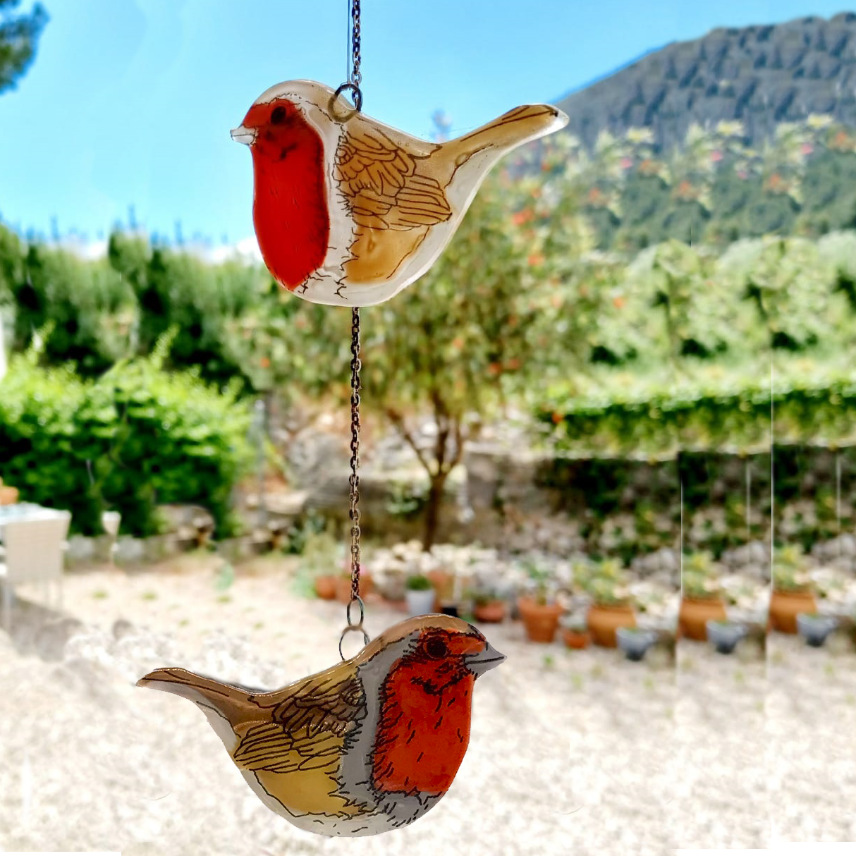 Pajarito de cristal pintado a mano en tonos brillantes